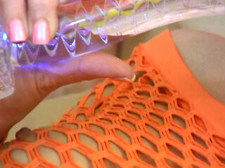 Hot teen in fishnet plays with her vibrator