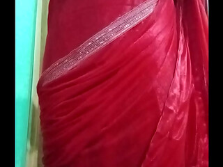 Indian Gay Crossdresser Bottom Gaurisissy pressing her big boobs and feeling horny in red saree with heavy jwellery