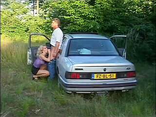 Busty MILF Gets Fucked on the Hood of the Car by a Big Cock That Cums in Her Mouth
