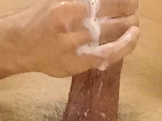 hotie boy uses soap on his big cock and big balls stroking his full length and having big orgasm