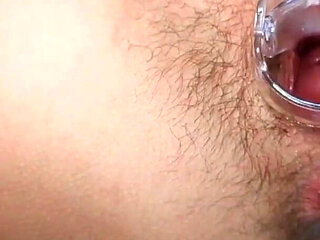 Open pussy using a speculum_orgasm in close up during