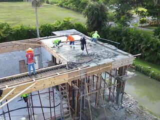 Reality outdoors video of some guys doing construction in HD