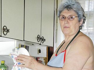 Gorgeous old lady Gerlinde is using a nice cucumber as a dildo
