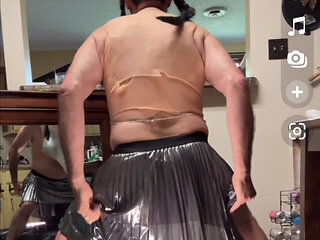 Shemale wearing see-through chainmail top shows off her nice rack