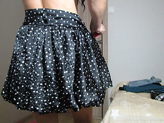 Trying on skirts by a lady without panties and in a bra with open nipples