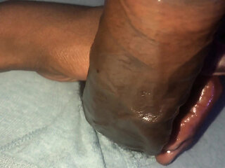 Stroking big black dick with coconut oil