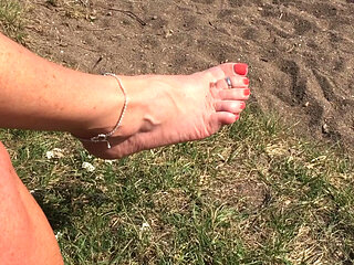 Mrs Mature Feet with her boobs and pussy out in the sun
