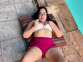 Relaxing, smoking and playing one by the pool with the construction workers on the side watching