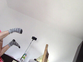 Amateur wife dancing naked at home. Amateur woman has fun trying on clothes and cutting them.