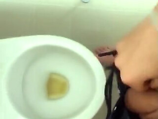 Tattooed Twink Is Pissing in Waterpark Piss Filled Toilet