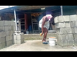 Village girl that went outside to bath trying to seduce handsome guys in her compound