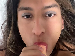 Natalia Valera uses her mouth to put a condom on her dildo and rides it