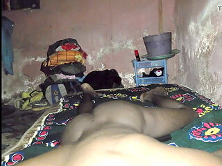 Handsome African guy getting off in his cozy rural room