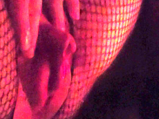 Muscle woman does it herself in fishnet stockings and wets herself