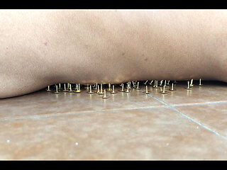 A Little Masochistic Submissive Lying on Thumbtacks