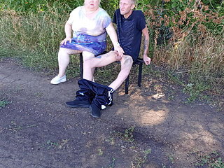 Stepmom sucks my dick in a public park on a bench until I cum