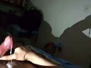 Shadow art in the dark night: reflection of the shadow of my penis and cum against the wall