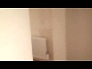 MILF in stockings and heels walks through the corridors of a hotel