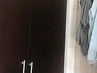 Amateur Wife Dancing Naked at Home. Amateur Woman Has Fun Trying on Clothes and Cutting Them.