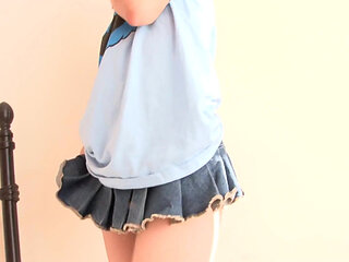 Redhead teen shows her small tits on the bed