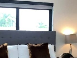 Brunette seductress working her big boobs and hot ass