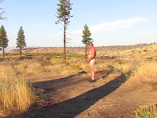 Naked throwing a log.