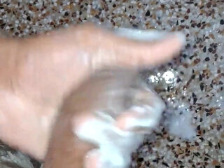 A Young Hindu Boy From India Is Fucking His Thick Cock Hard with His Hands While Taking a Bath