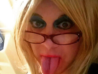 Sexy crossdresser Krissy Sweets in lingerie and high heels with fishnet stockings