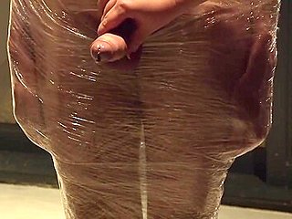 Male Slave Bound In Cling Wrap Gets Riding Crop Cbt By Two Gorgeous Femdoms