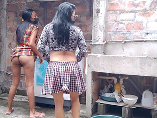 Gossipy neighbors talk dirty in the neighborhood yard. They have small buttocks.