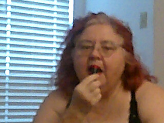 Mature BBW Redhead Nurse Vicki Talks to You as She Makes a Lipstick Applying Video for You!