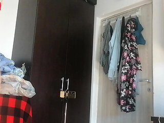 Amateur woman has fun trying on clothes and cutting them.