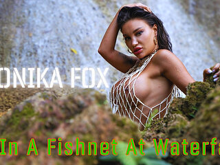 Wet Monika Fox in a Fishnet at Waterfall