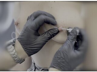 Sexy Wife Piercing Her Nipples In A Piercing Studio. Close Up