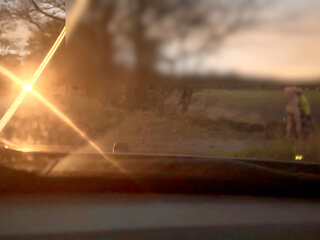 Leaving the car in just a long coat and been naked between passing cars