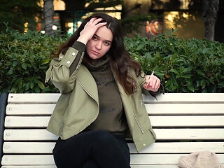 Young Brunette Is Taking an Unhurried Stroll with Allwhite 120mm Cigarette