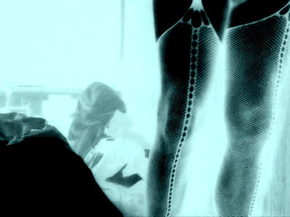 Femboy in fishnet stockings and stripper heels