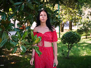 Sultry Brunette in Red Dress Smoking Rolled Cigarette