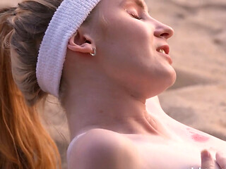 Athletic girls are licking muff after beach volleyball