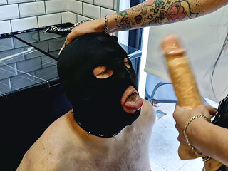 Mistress Nika fucks a slave in the mouth, humiliates, spits, slaps and orders him to suck deeper