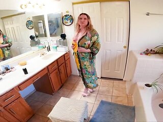 The blonde woman is on her knees and ready to suck