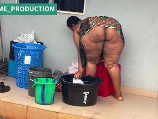 African Mama Multitasks on a Sunday Morning