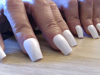 Tapping clicking white fingernails