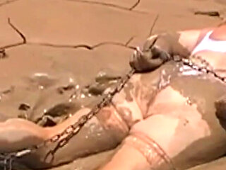 Julie Cunningham in Lingerie Wriggles Hard in Mud Hogtied with Chains. Sploshing Dirty Whore. Huge Tits Covered in Mud.