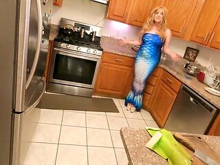 Busty blonde woman is fucked deep in the kitchen