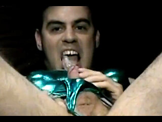 Stroking cock gets huge load in shemale's mouth.