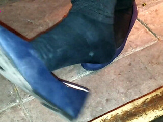 Dangling in Blue Ballet Flats in a Bar