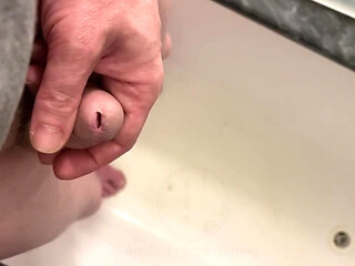 Amateur Boy Pissing, with Close-up and Good Quality Slow Motion of the Load of Pee Coming Out of the Pee-hole (urethra)