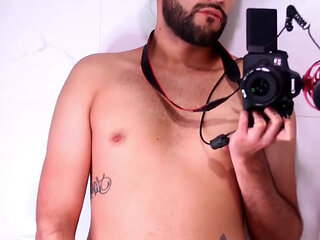 Horny latino stroking his big uncut dick in the mirror until he cums