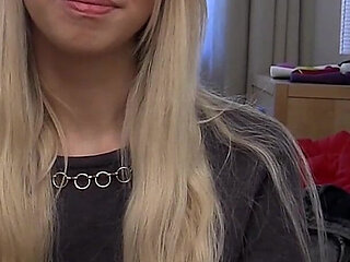 Blonde Babe Grips Purple Vibrator with Naughty Smile